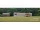 Charming single-story home with siding, a porch and a lush lawn surrounded by mature trees at 544 Bentley Rd, Shelby, NC 28152