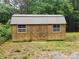 Exterior view of storage outbuilding with double doors and two windows at 544 Bentley Rd, Shelby, NC 28152