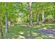 Large grassy backyard featuring mature trees and shade at 612 Summerow Rd # Lot 22, Stanley, NC 28164