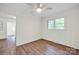 Bright and empty room with plank floors and ceiling fan at 612 Summerow Rd # Lot 22, Stanley, NC 28164