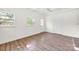 Bright bedroom with white walls, two windows, and new wood-look flooring at 612 Summerow Rd # Lot 22, Stanley, NC 28164