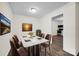 Elegant dining room featuring modern laminate flooring, stylish decor, and an adjacent updated kitchen for convenient dining at 612 Summerow Rd # Lot 22, Stanley, NC 28164