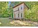 Rustic home exterior with a wood porch and natural light at 612 Summerow Rd # Lot 22, Stanley, NC 28164