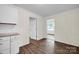 Bright kitchen area with updated cabinetry, modern flooring, and access to other parts of the home at 612 Summerow Rd # Lot 22, Stanley, NC 28164