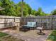 Backyard patio with a fire pit and seating area, perfect for outdoor entertaining at 613 W Pine St, Kershaw, SC 29067