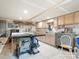 Large basement with a workshop and lots of cabinets for storage at 613 W Pine St, Kershaw, SC 29067