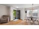 Inviting home entryway with dark door, hardwood floors, furniture and decor at 613 W Pine St, Kershaw, SC 29067