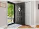 Inviting home entryway with dark door and decorative welcome mat plus views of the outside at 613 W Pine St, Kershaw, SC 29067