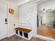 An inviting foyer with built-in bench seating and storage, leading into the kitchen at 613 W Pine St, Kershaw, SC 29067