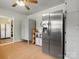 Bright kitchen with stainless steel refrigerator, hardwood floors, and plenty of storage space at 613 W Pine St, Kershaw, SC 29067