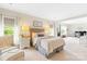 Light-filled bedroom features a sitting area, large windows, and stylish decor with soothing colors at 619 Vega Nw St, Concord, NC 28027