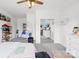 Bright bedroom features a hanging chair, walk-in closet, and calming, neutral decor with a ceiling fan at 619 Vega Nw St, Concord, NC 28027