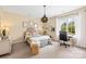 Cozy bedroom with neutral colors, ample natural light, decorative lighting, and workspace at 619 Vega Nw St, Concord, NC 28027