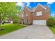 Beautiful brick home with a two-car garage and long driveway on a sunny day at 619 Vega Nw St, Concord, NC 28027