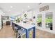 Spacious kitchen featuring an island, white cabinets, and an open layout into the living area at 619 Vega Nw St, Concord, NC 28027
