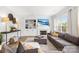 Cozy living room with a fireplace, large sectional sofa, and built-in shelving at 619 Vega Nw St, Concord, NC 28027