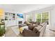 Spacious living room featuring a large sectional sofa, fireplace, and built-in shelving at 619 Vega Nw St, Concord, NC 28027