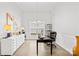 Bright home office features hardwood floors, a modern desk, and ample natural light at 619 Vega Nw St, Concord, NC 28027