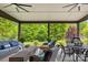 Inviting covered patio with comfortable seating and views of the lush backyard at 619 Vega Nw St, Concord, NC 28027