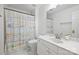 Bathroom featuring white cabinets, tile flooring, and cute shower curtain at 6723 Joliette Ln, Charlotte, NC 28277