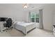 Inviting bedroom with bed, desk, large window, and plenty of space at 6723 Joliette Ln, Charlotte, NC 28277