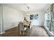 Elegant dining room featuring wood floors, wainscoting, and stylish light fixture at 6723 Joliette Ln, Charlotte, NC 28277