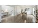 Elegant dining room with wainscoting, wood floors, and modern lighting fixture at 6723 Joliette Ln, Charlotte, NC 28277