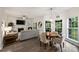 Cozy living room with fireplace, adjacent dining area with ample natural light and comfortable seating at 6723 Joliette Ln, Charlotte, NC 28277
