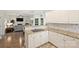 Open-concept layout connecting a kitchen with an elegant living area and fireplace at 6723 Joliette Ln, Charlotte, NC 28277