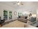 Sunlit living space with a fireplace, french doors and seamless flow into a modern kitchen at 6723 Joliette Ln, Charlotte, NC 28277