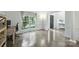 Inviting home office with wood floors, ample natural light, and modern decor at 6723 Joliette Ln, Charlotte, NC 28277
