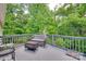 Secluded back deck overlooking lush greenery, offering a tranquil outdoor retreat at 735 Shuttles Way, Fort Mill, SC 29715
