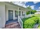 Inviting front porch with brick steps, white railing, and a gray front door at 735 Shuttles Way, Fort Mill, SC 29715