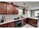 This kitchen features beautiful dark wood cabinets, stainless steel sink, and great countertop space at 735 Shuttles Way, Fort Mill, SC 29715