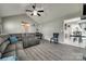 Open living room with vaulted ceiling, gray sofa, and tile flooring at 735 Shuttles Way, Fort Mill, SC 29715