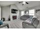 Cozy living room with fireplace, TV, and tile flooring under a vaulted ceiling at 735 Shuttles Way, Fort Mill, SC 29715