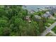 An aerial view of a beautiful lakeside property, featuring mature trees, a swimming pool, and convenient parking at 7942 Vista View Dr, Sherrills Ford, NC 28673