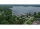 Expansive aerial view of a waterfront community showcasing stunning lake access, lush greenery, and tranquil living at 7942 Vista View Dr, Sherrills Ford, NC 28673