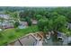 Aerial view of a waterfront home with a pool, a landscaped lawn and a private boat dock at 7942 Vista View Dr, Sherrills Ford, NC 28673