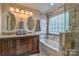 Spa-like bathroom with dual sinks, soaking tub, and elegant tiling, for a relaxing experience at 7942 Vista View Dr, Sherrills Ford, NC 28673