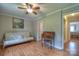 Bedroom featuring wood-look floors, a futon couch and a doorway to the home's other rooms at 7942 Vista View Dr, Sherrills Ford, NC 28673