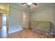 Bedroom with wood-look floors, white trim and a cabinet bed, offering comfort and versatility at 7942 Vista View Dr, Sherrills Ford, NC 28673