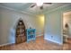 Bedroom featuring wood-look floors, decorated shelves, and a doorway to an ensuite bathroom at 7942 Vista View Dr, Sherrills Ford, NC 28673