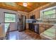 Galley kitchen featuring stainless steel appliances, granite countertops, and laminate flooring at 7942 Vista View Dr, Sherrills Ford, NC 28673
