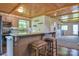Updated kitchen with bar seating, stainless appliances, and adjacent dining and living areas at 7942 Vista View Dr, Sherrills Ford, NC 28673