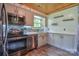 Modern kitchen with stainless steel appliances, mosaic tile backsplash, and granite countertops at 7942 Vista View Dr, Sherrills Ford, NC 28673