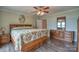 Comfortable main bedroom features hardwood floors, warm tones, and tranquil space to unwind and relax at 7942 Vista View Dr, Sherrills Ford, NC 28673