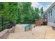 Backyard pool surrounded by concrete patio, landscaping, and a fenced perimeter for privacy at 968 Autumn Glen Ct, Clover, SC 29710