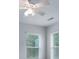 This bedroom has two windows with blinds, neutral walls, carpet, and a ceiling fan with lights at 968 Autumn Glen Ct, Clover, SC 29710