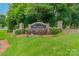 Well-manicured Rosedale community entrance sign surrounded by lush greenery and colorful flowers, creating a welcoming ambiance at 968 Autumn Glen Ct, Clover, SC 29710